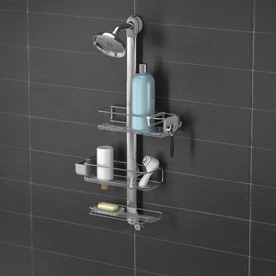 Angled view of Simplehuman Large Adjustable Shower Caddy, Polished Stainless Steel, holding shower essentials with quick-dry adjustable shelves.