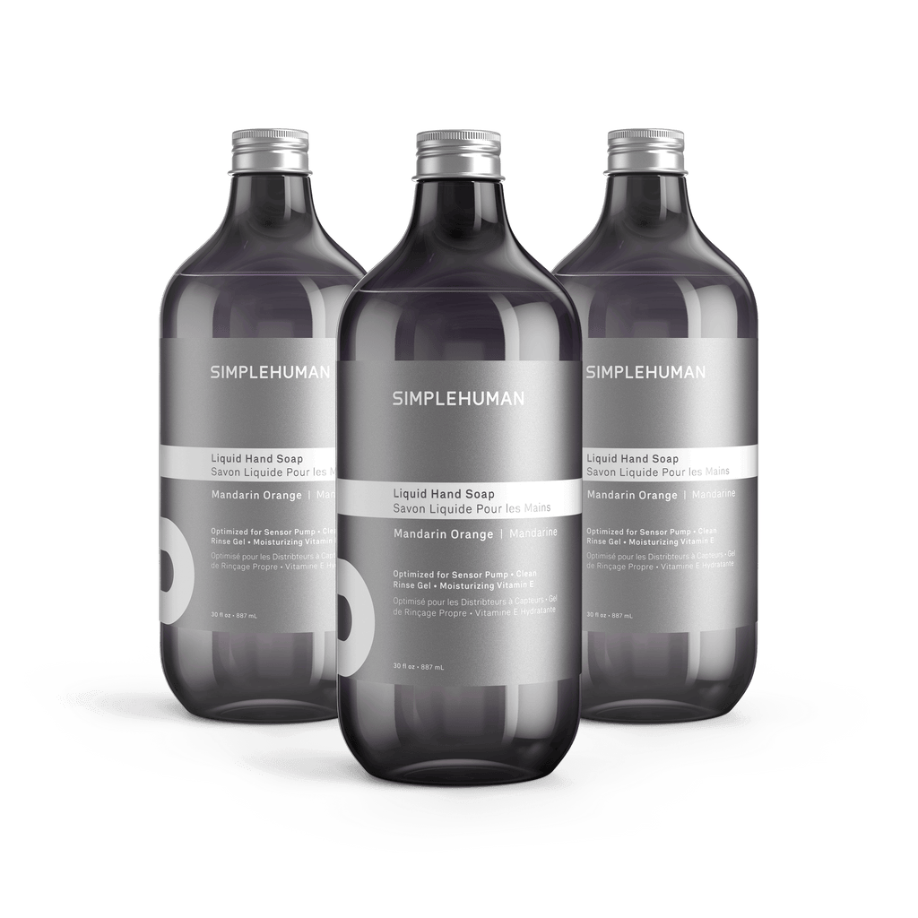 Simplehuman's Mandarin Orange Liquid Hand Soap in 3 charcoal colored bottles and titanium caps.