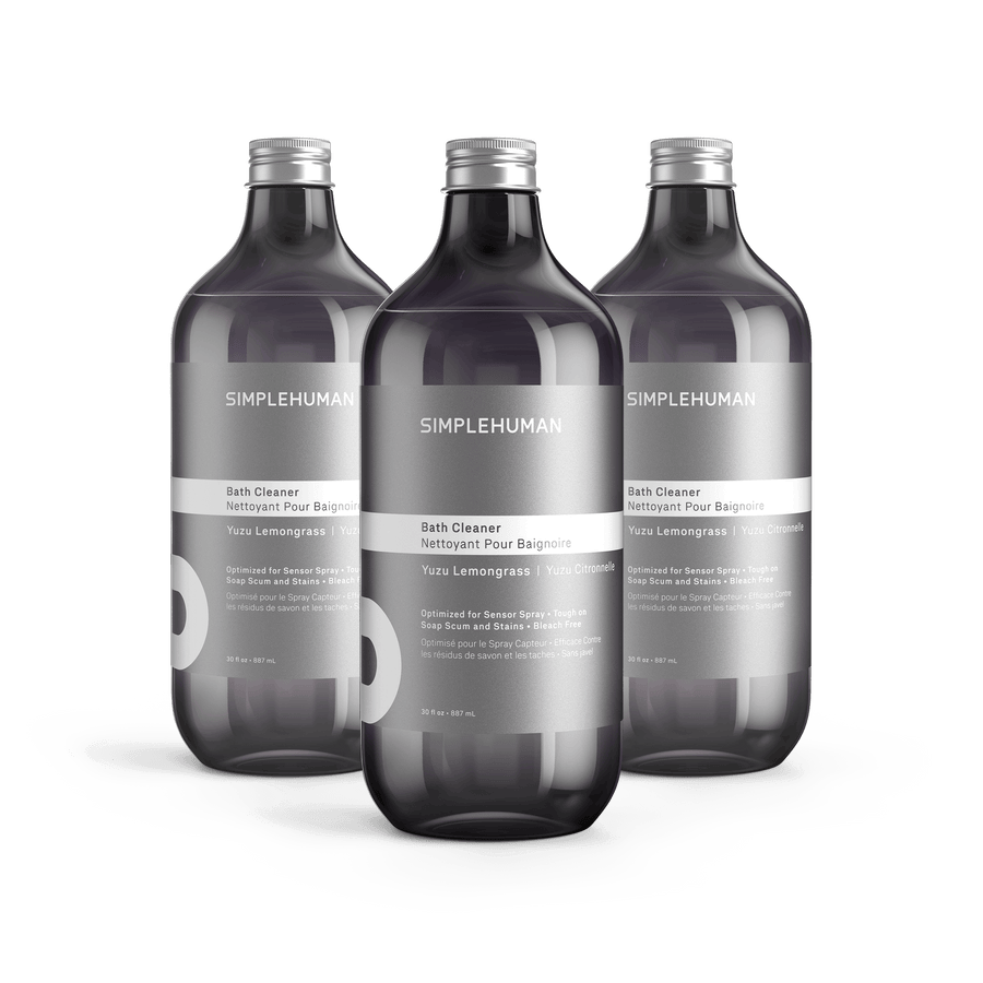 Simplehuman's Yuzu Lemongrass Bath Cleaner in 3 charcoal colored bottles and titanium caps.