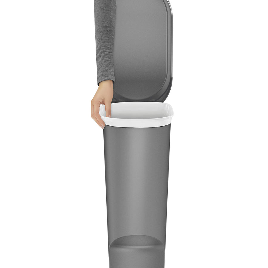 Close-up, Simplehuman Grey 40L Slim Step Can showing hand adjusting the liner bag under the rim.