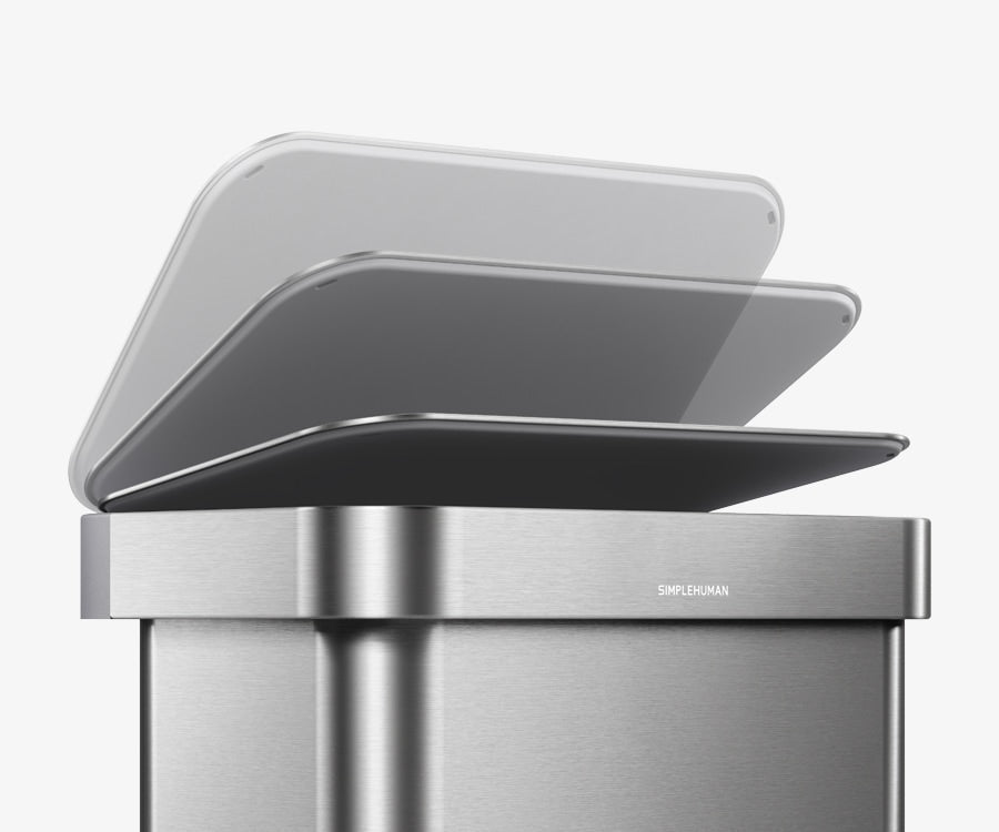 Simplehuman's 58L Step Can in Brushed showcasing how the can has a soft close feature allowing for a seamless and quiet trash experience. The image features the soft and slow closing on the cans at an angle. 