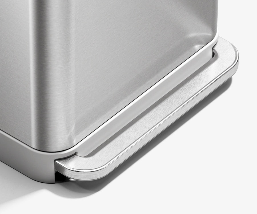 This image features Simplehuman's 58L Step Can in Brushed. It is zoomed on the step portion of the can.