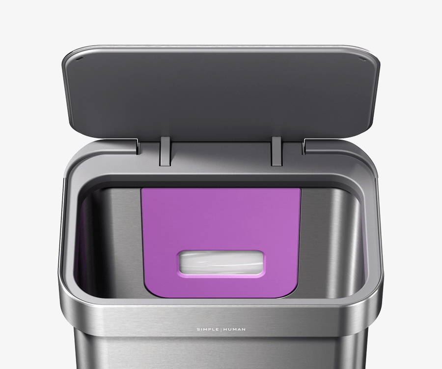 Simplehuman's 45L Step Can in Brushed has a liner pocket outlined in purple that allows users to easily dispense liners for a quick and easy change. 
