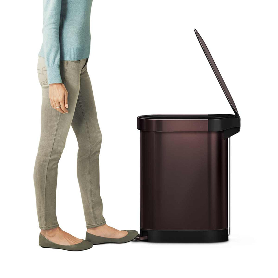 Side view of Simplehuman 45L Slim Step Can, Bronze finish, demonstrating hands-free pedal use.
