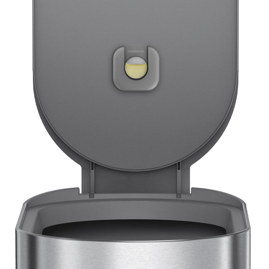 Close-up: Simplehuman 45L Slim Step Can, Brushed Stainless Steel, showing open lid, liner rim, and Odorsorb Pod.