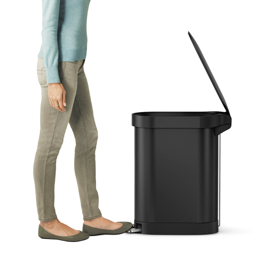 Simplehuman 45L Slim Step Can, Matte Black. Side view demonstrating hands-free step pedal use.