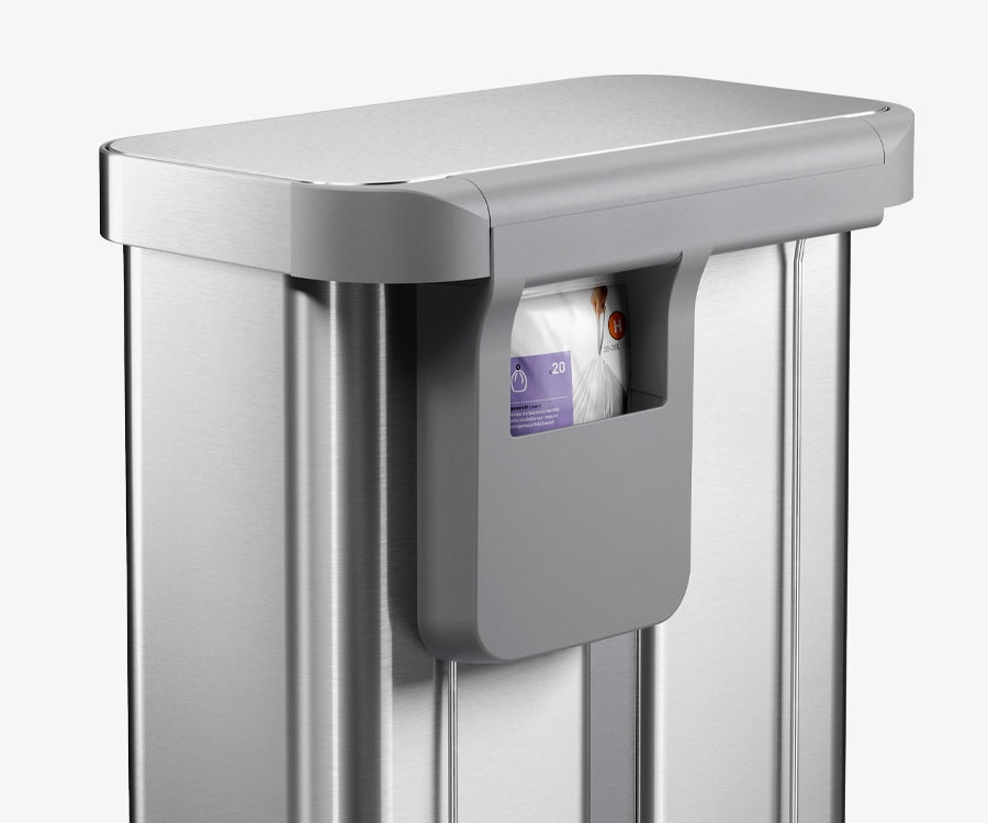 This image showcases the Simplehuman 58L Step Recycler in Brushed and it's ability to store the Code H Custom Fit Liners in the back storage pocket.
