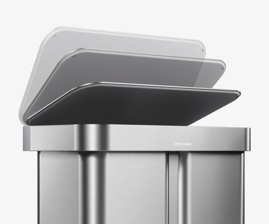 Simplehuman's 58L Step Recycler in Brushed showcasing how the can has a soft close feature allowing for a seamless and quiet trash experience. The image features the soft and slow closing on the cans at an angle. 
