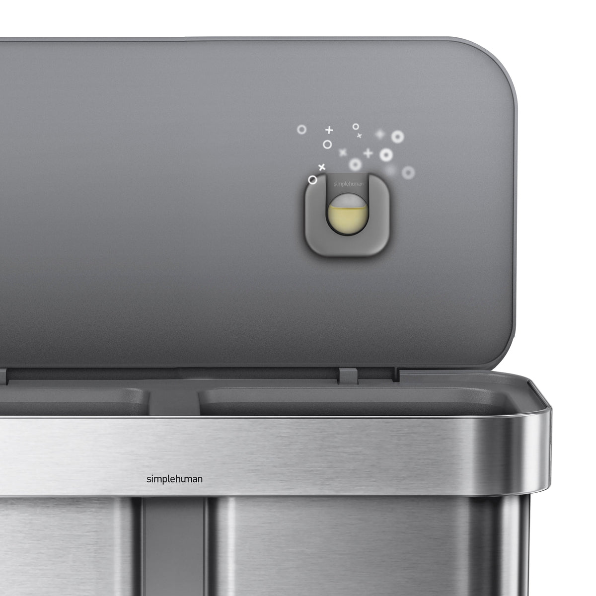 Detail view of the Simplehuman Odorsorb dispenser installed under the lid, showing the removable refill pod.