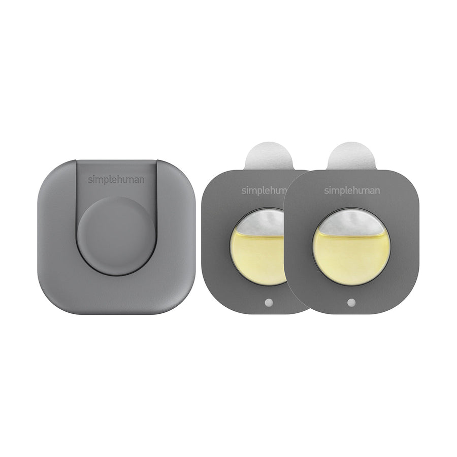 Detail view of Simplehuman Odorsorb reusable holder and two odor absorption refill cartridges.