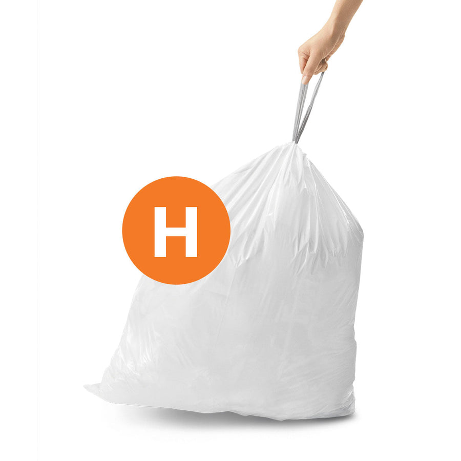 Simplehuman Code H Custom Fit Liner being lifted, showing strong drawstring carry handle.