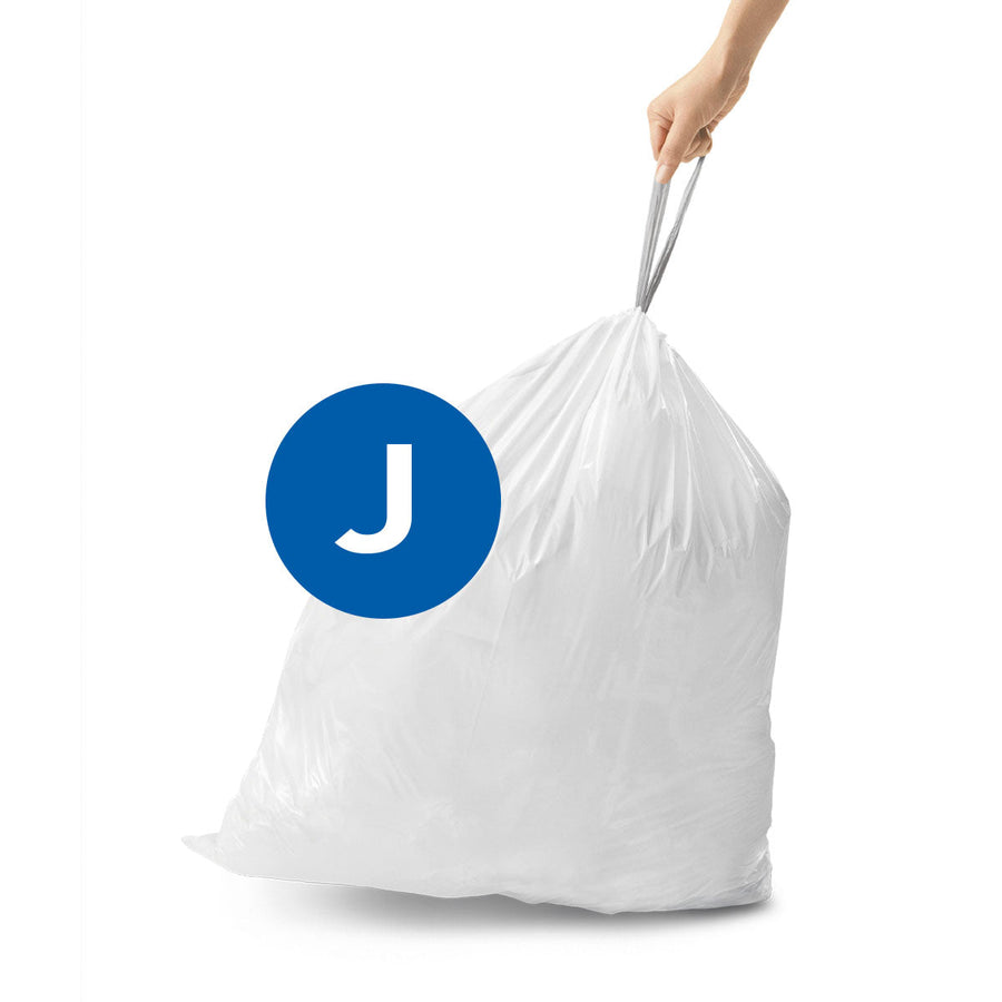 Simplehuman Custom Fit Liner Code J (white) usage shot showing hand carrying the full, secured bag by the strong drawstring.