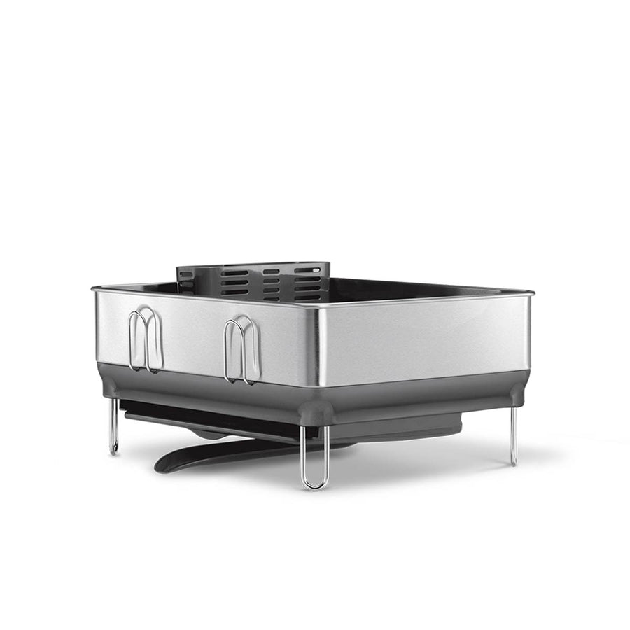 Angled view of Simplehuman Compact Steel Frame Dishrack in Brushed Stainless Steel showing utensil holder and draining spout.