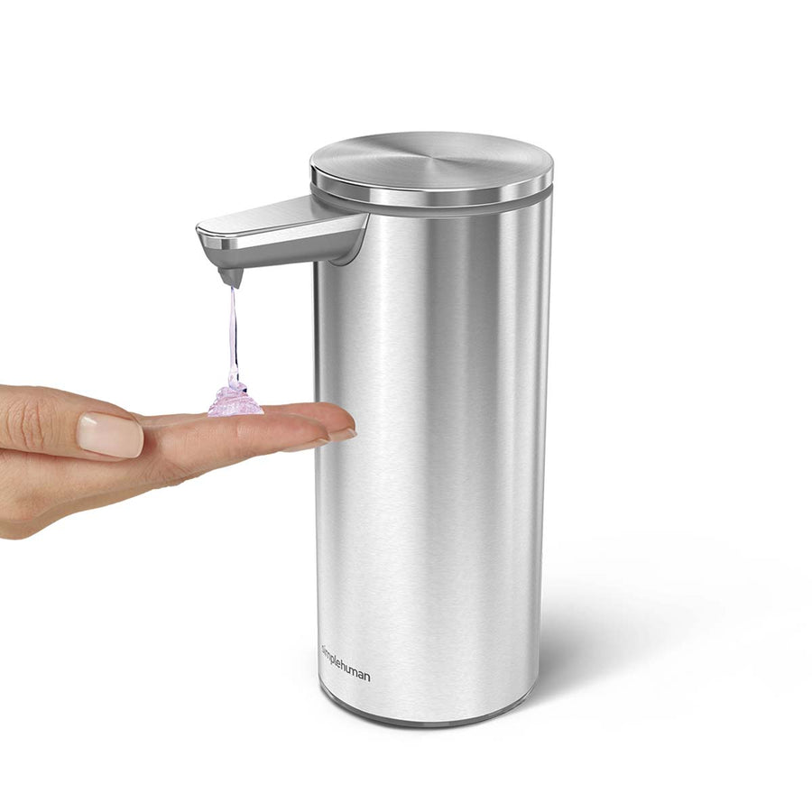 Detail view of Simplehuman 9 oz. Rechargeable Sensor Pump, Brushed Stainless Steel, dispensing soap hands-free.
