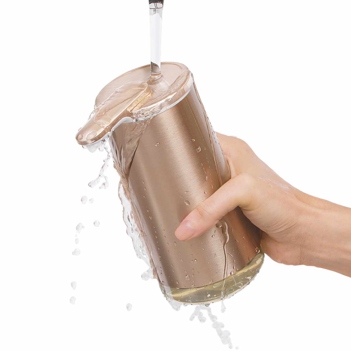 Simplehuman Rose Gold Foam Sensor Pump under running water, showing fully waterproof design for easy cleaning.