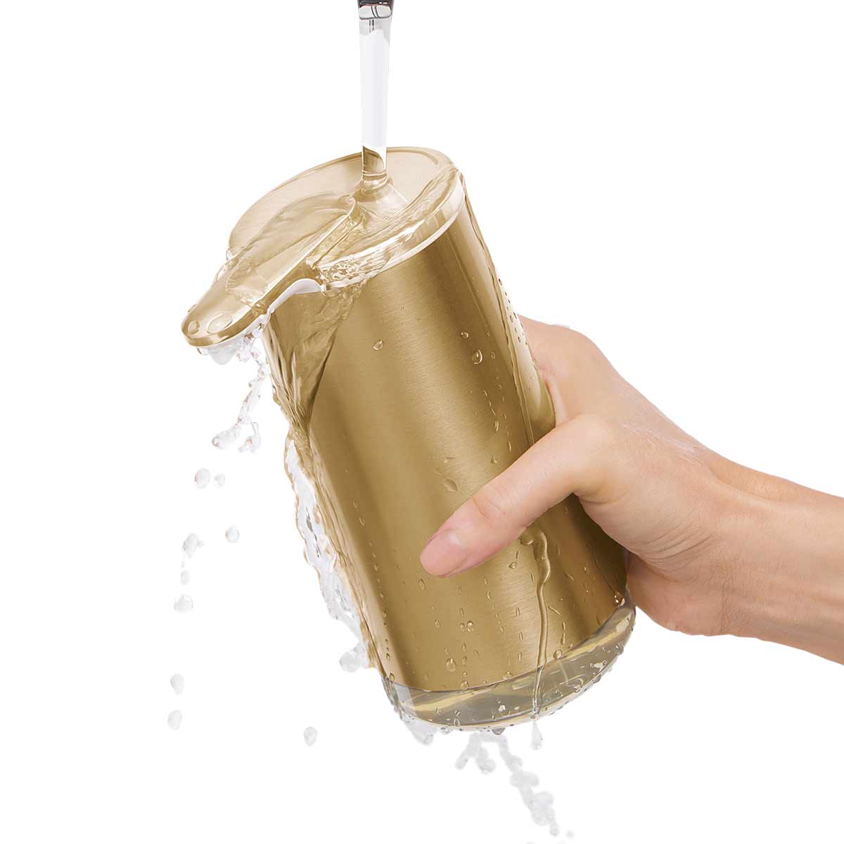 Close-up of Simplehuman Brass Foam Sensor Pump being washed under running water, fully waterproof design.
