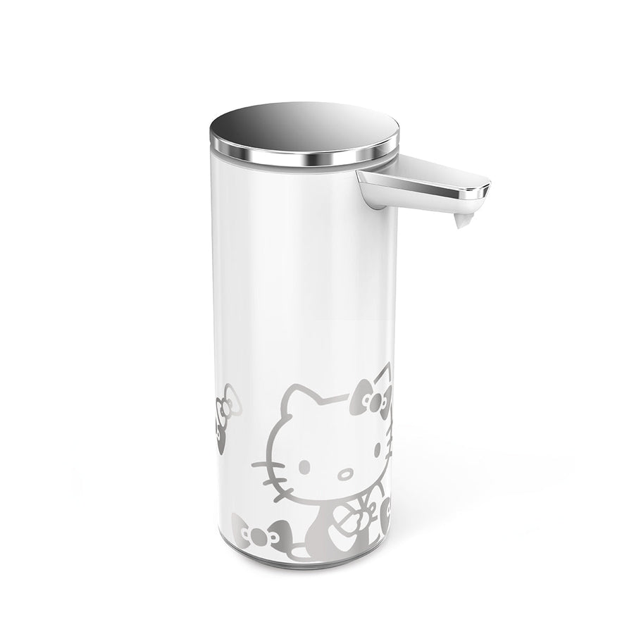 Angled view: Simplehuman 9 oz. Sensor Pump (White/Polished Stainless Steel) with silver Hello Kitty graphic, touch-free.