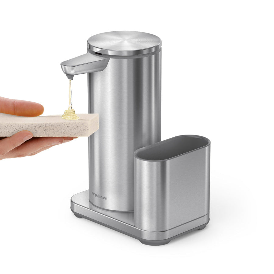 Simplehuman Brushed Stainless Steel Sensor Pump 14 oz. dispensing soap onto sponge with removable storage caddy. Hands-free use.