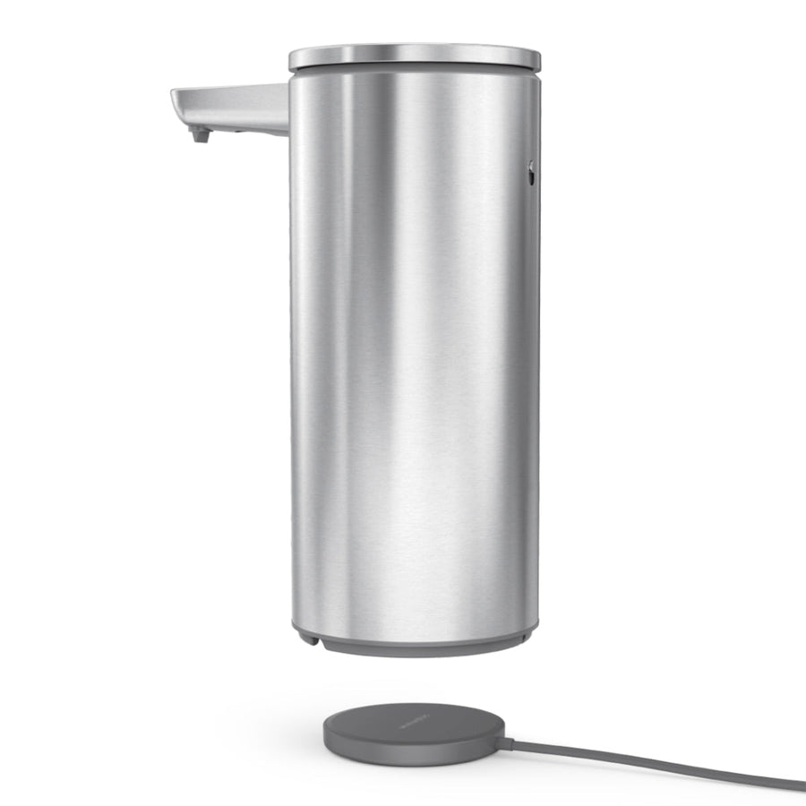 Simplehuman Brushed Stainless Steel Sensor Pump 14 oz. floating above rechargeable dock. Hands-free operation.