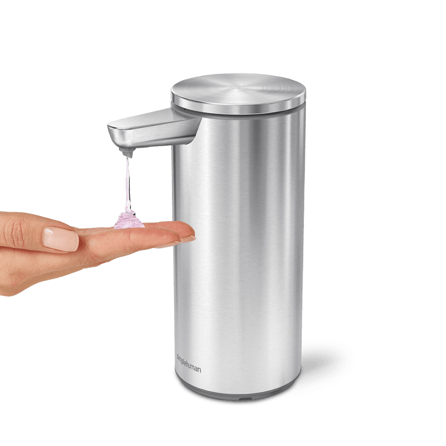 Angled view of Simplehuman 9 oz. Rechargeable Sensor Pump, Brushed Stainless Steel, showing touch-free soap dispensing.