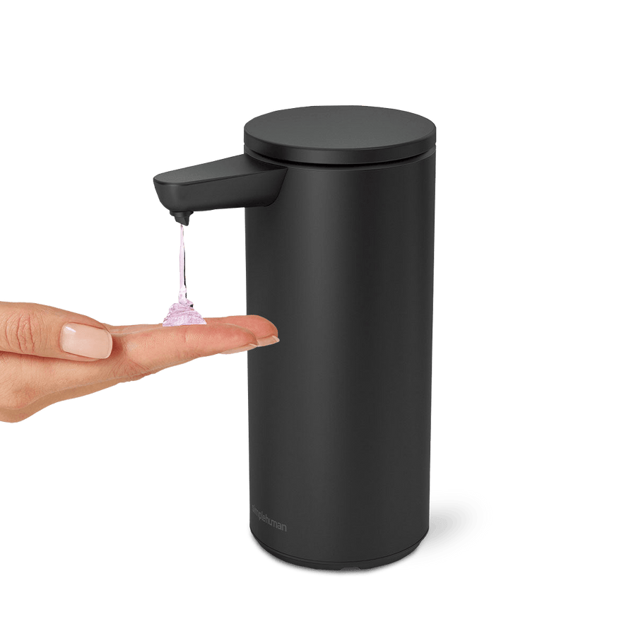 Simplehuman 9 oz. Sensor Pump, Matte Black, dispensing soap onto a hand, touch-free operation.