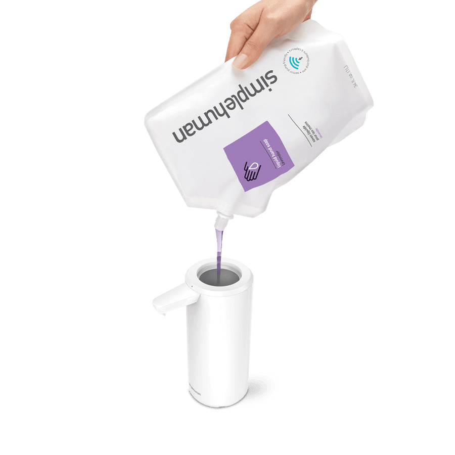Detail view of Simplehuman 9 oz. Sensor Pump in White, showing easy top-loading refill from soap pouch.