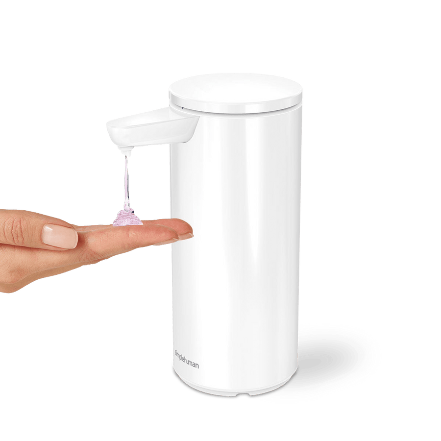 Simplehuman 9 oz. Rechargeable Sensor Pump, White, dispensing soap onto hand, touch-free operation.