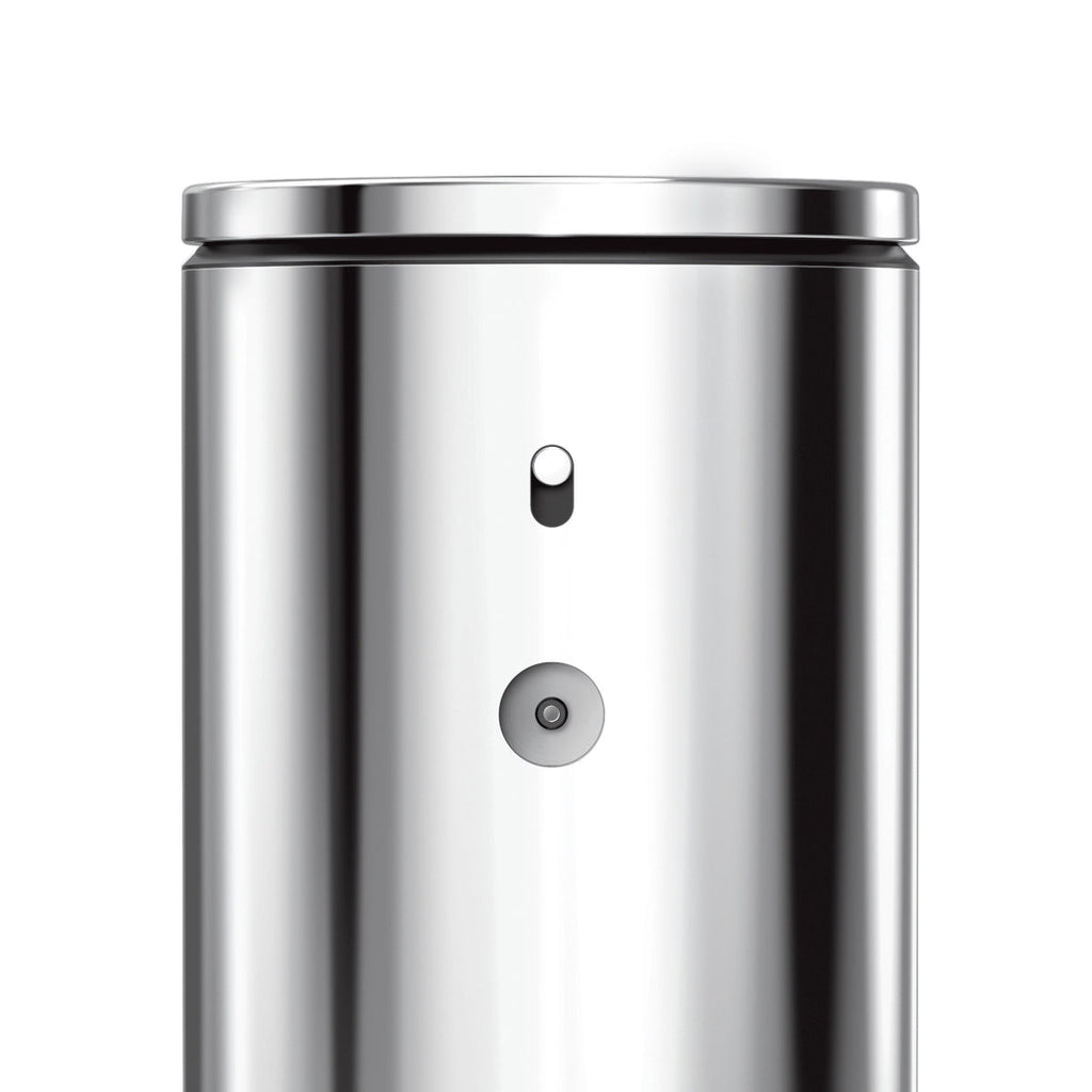 Detail view of Simplehuman 9 oz. Sensor Pump, Stainless Steel, highlighting the power switch and magnetic charge port.