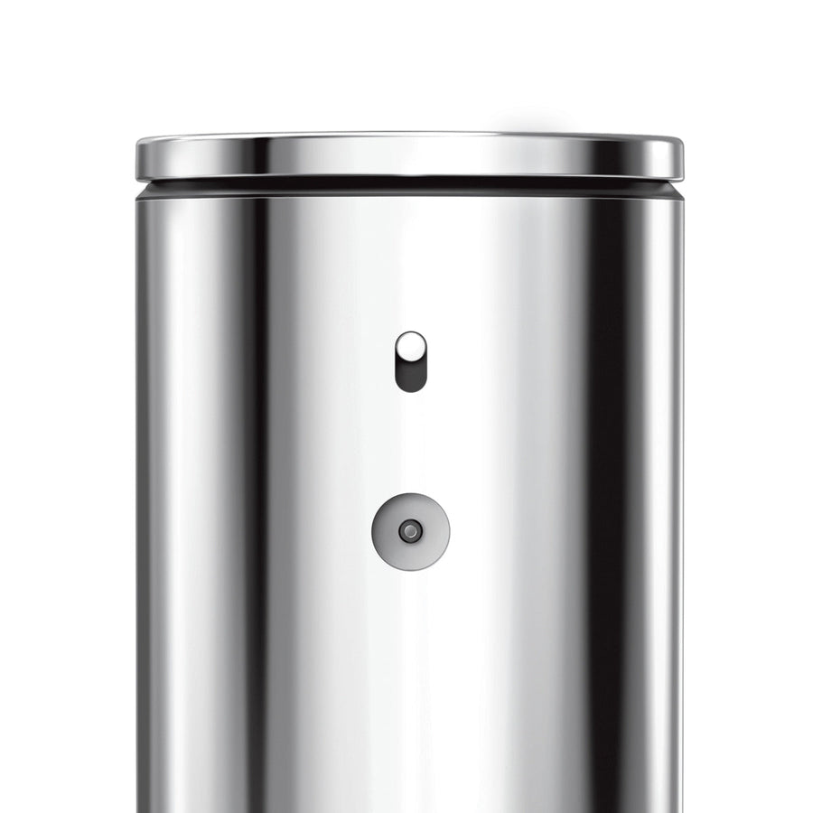 Detail view of Simplehuman 9 oz. Sensor Pump, Stainless Steel, highlighting the power switch and magnetic charge port.
