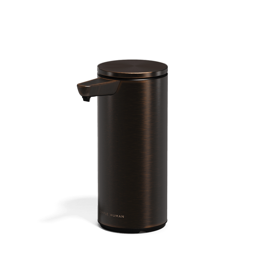 Studio view of Simplehuman 9 oz. Rechargeable Sensor Pump in Bronze, touch-free dispensing, drip-free nozzle.