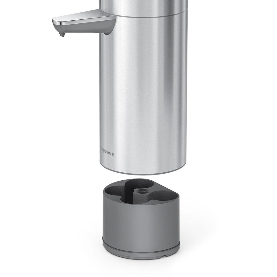Detail view of Simplehuman Sensor Pump Max separating from the tool caddy base, Brushed Stainless Steel, hands-free.