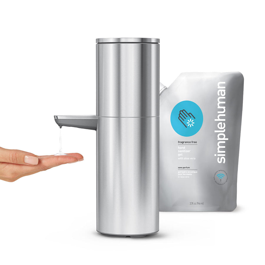 Simplehuman Sensor Pump Max in Brushed Stainless Steel, hands-free dispensing, next to 32 oz sanitizer refill.