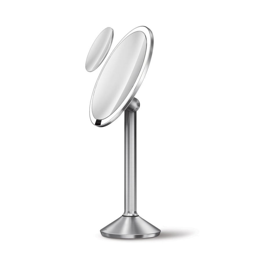 Studio shot of Simplehuman Sensor Mirror Pro Round, Brushed Stainless Steel, with magnetic zoom mirror and tru-lux light.
