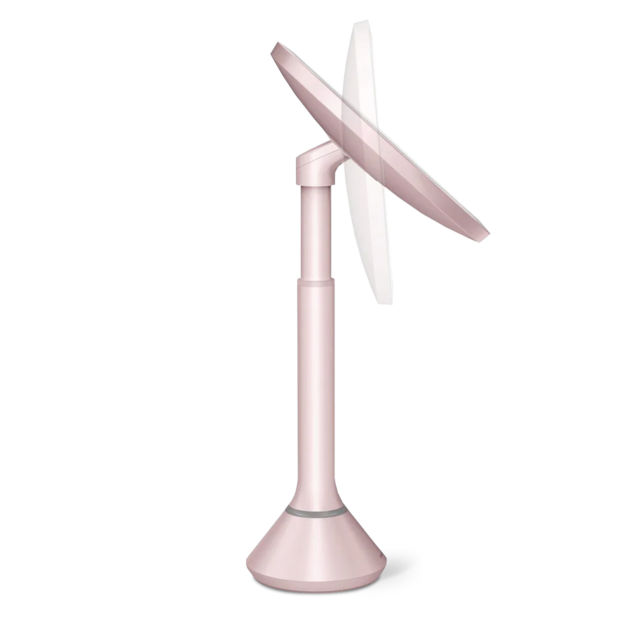 Adjustable height view, Simplehuman Rose Gold Sensor Mirror Round with pivoting tilt feature.