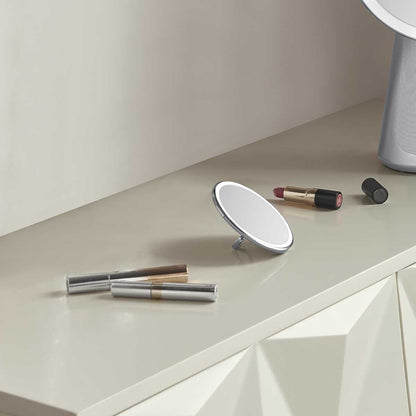 sensor mirror compact 10x - brushed finish - lifestyle mirror on vanity image