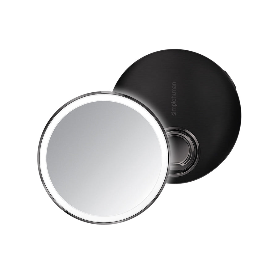 Simplehuman Sensor Mirror Compact 3x in Matte Black, open view with sensor lighting and adjustable ring handle.