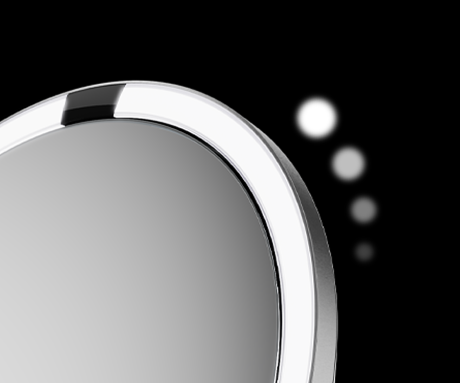 Close up of Simplehuman's Sensor Mirror Trio Max in Brushed showing it's ability to adjust the strength of the lighting options.