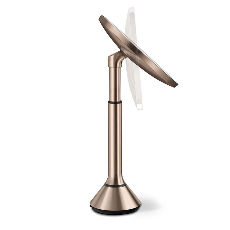 Side profile view of Simplehuman Rose Gold Sensor Mirror Round showing the adjustable stand and pivot mechanism.