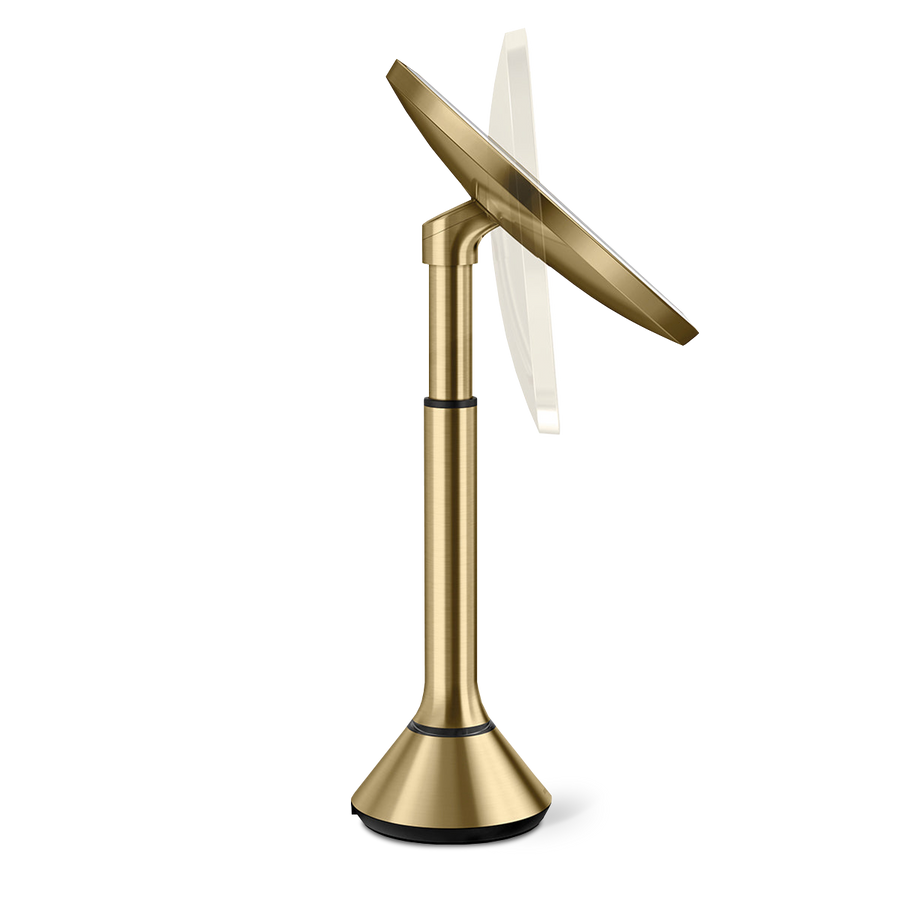 Side profile, Simplehuman Brushed Brass Sensor Mirror Round highlighting the adjustable pivoting tilt feature.