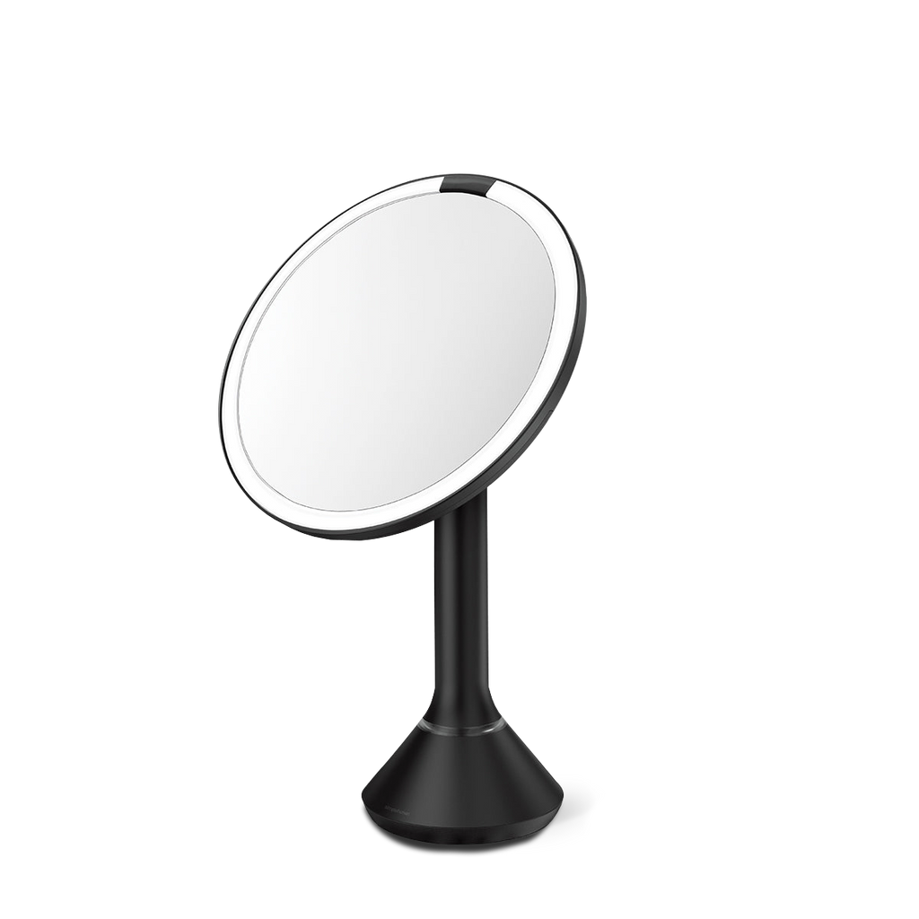 Angled view, Simplehuman Matte Black Sensor Mirror Round with adjustable tilt and dual light settings.
