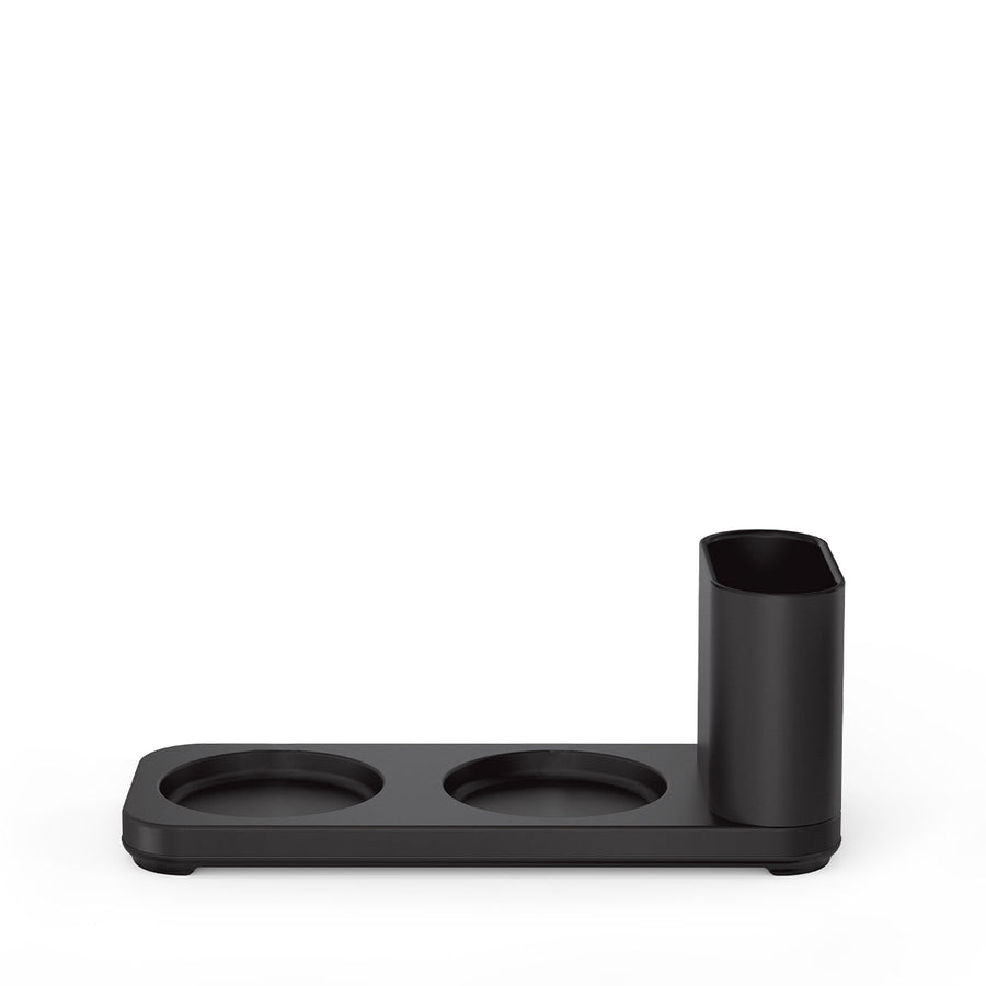 Studio shot of Simplehuman Matte Black Dual Caddy base with two pump recesses and integrated tool holder.