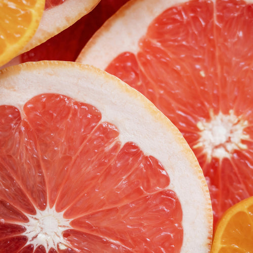 Close up of a grapefruit representing Simplehuman's Citrus Grapefruit scent.