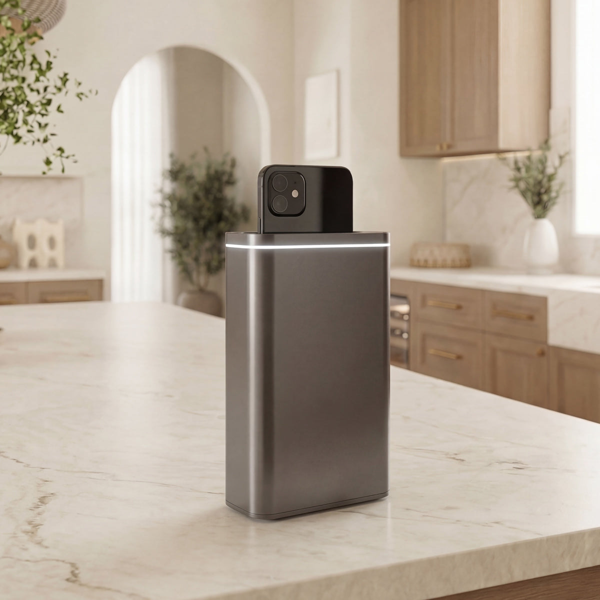 Simplehuman's Cleanstation in a warm-lit kitchen setting with an iPhone going through the device.