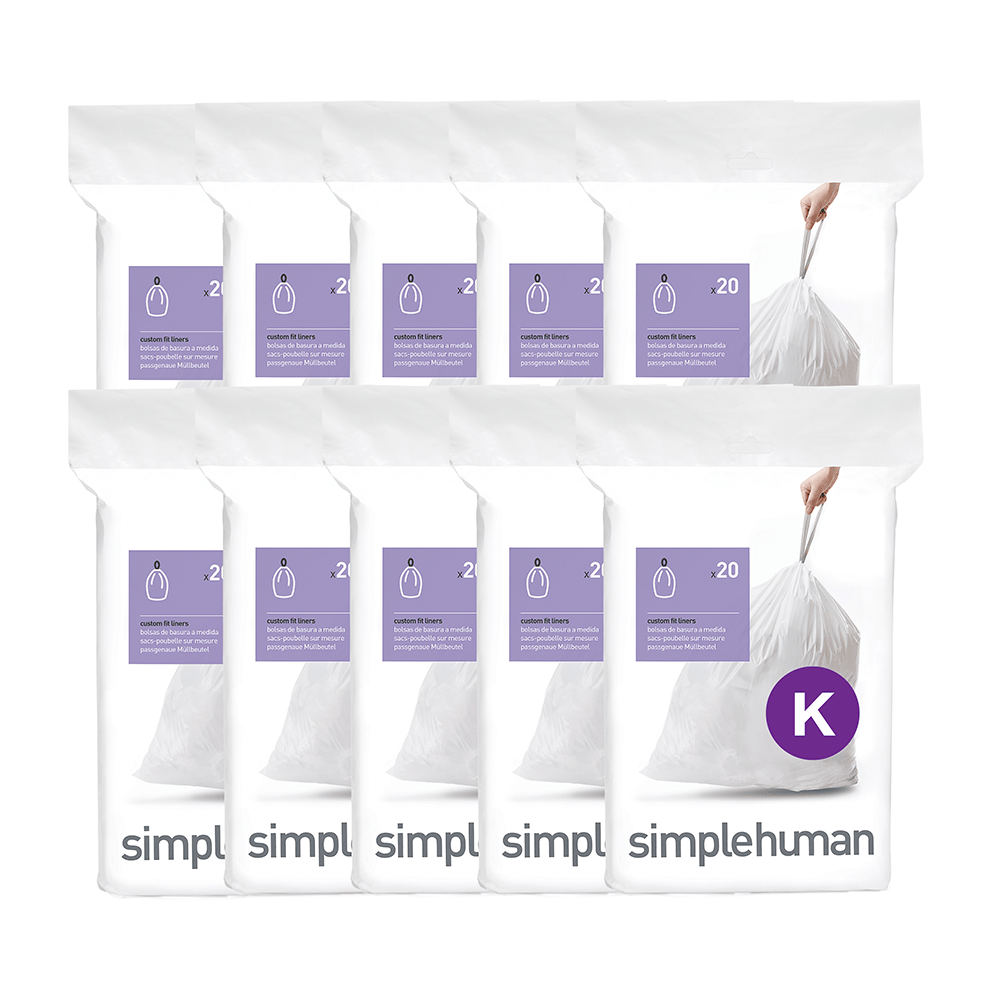 Bulk display of Simplehuman white Code K Custom Fit Liners (10 packs), featuring strong drawstring closure for easy removal.