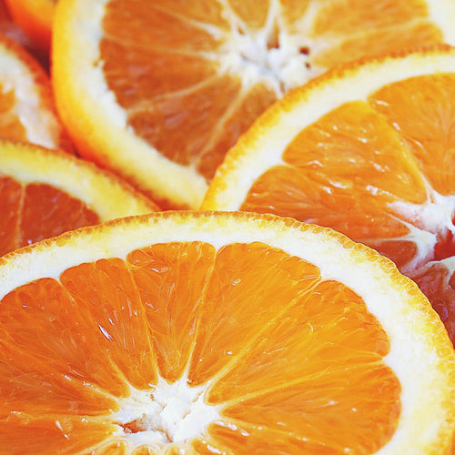 A close up of oranges representing Simplehuman's Mandarin Orange scent.