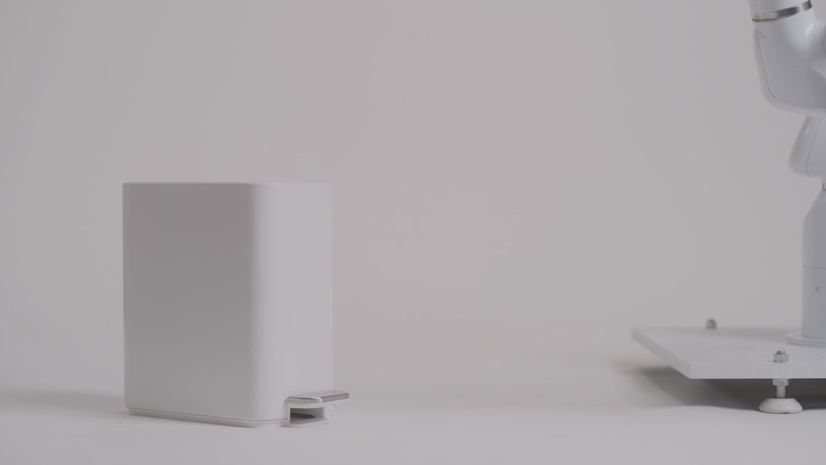 Simplehuman's 5L Slim Step Can being tested on durability with robotic arm. 
