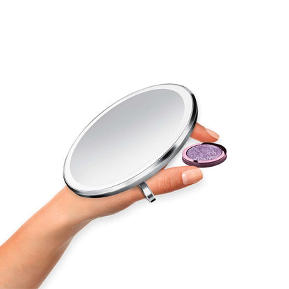 sensor mirror compact 10x - brushed finish - hand holding makeup image